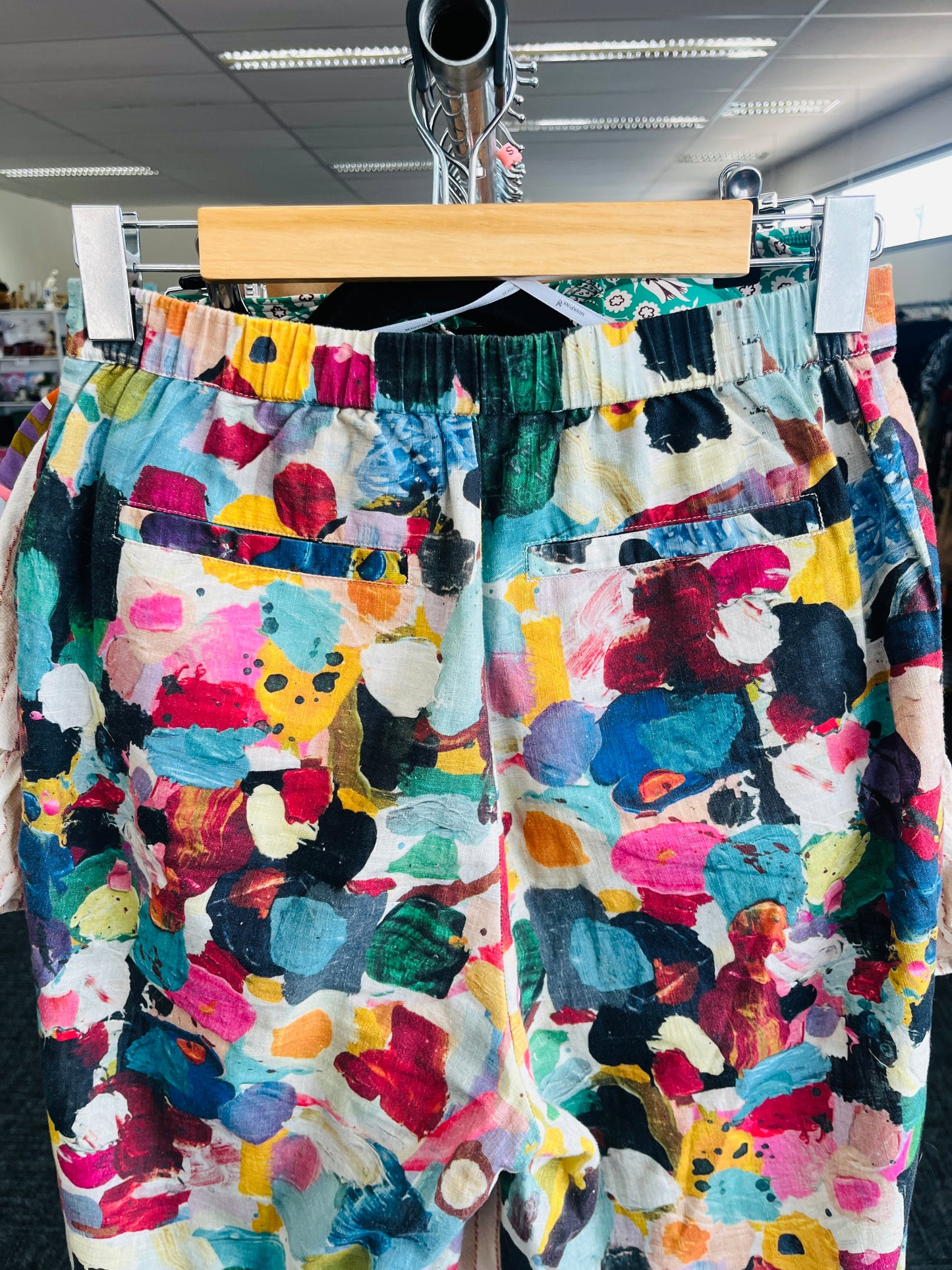 Colorful patterned pants on a hanger