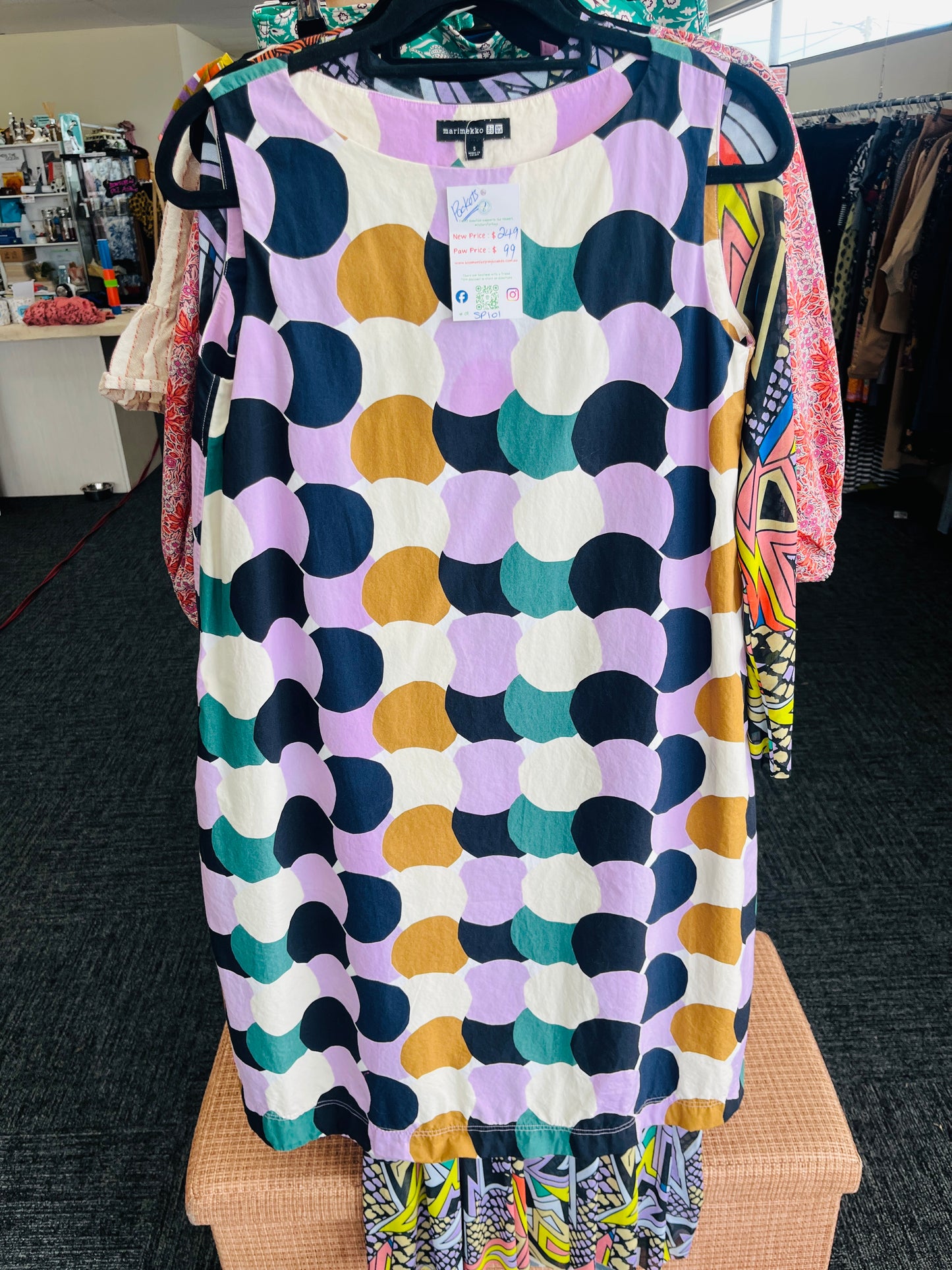 Colorful patterned dress on a hanger
