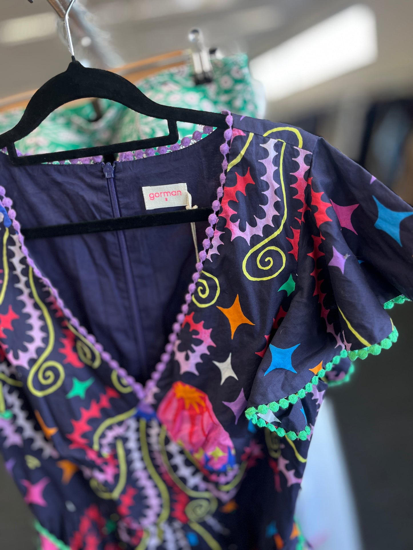 Colorful patterned garment on a hanger