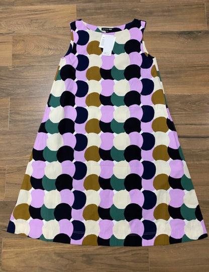 Colorful patterned dress on a wooden floor