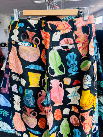 Colorful patterned pants on a hanger