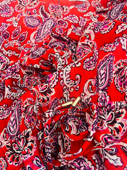 Red fabric with pink paisley pattern