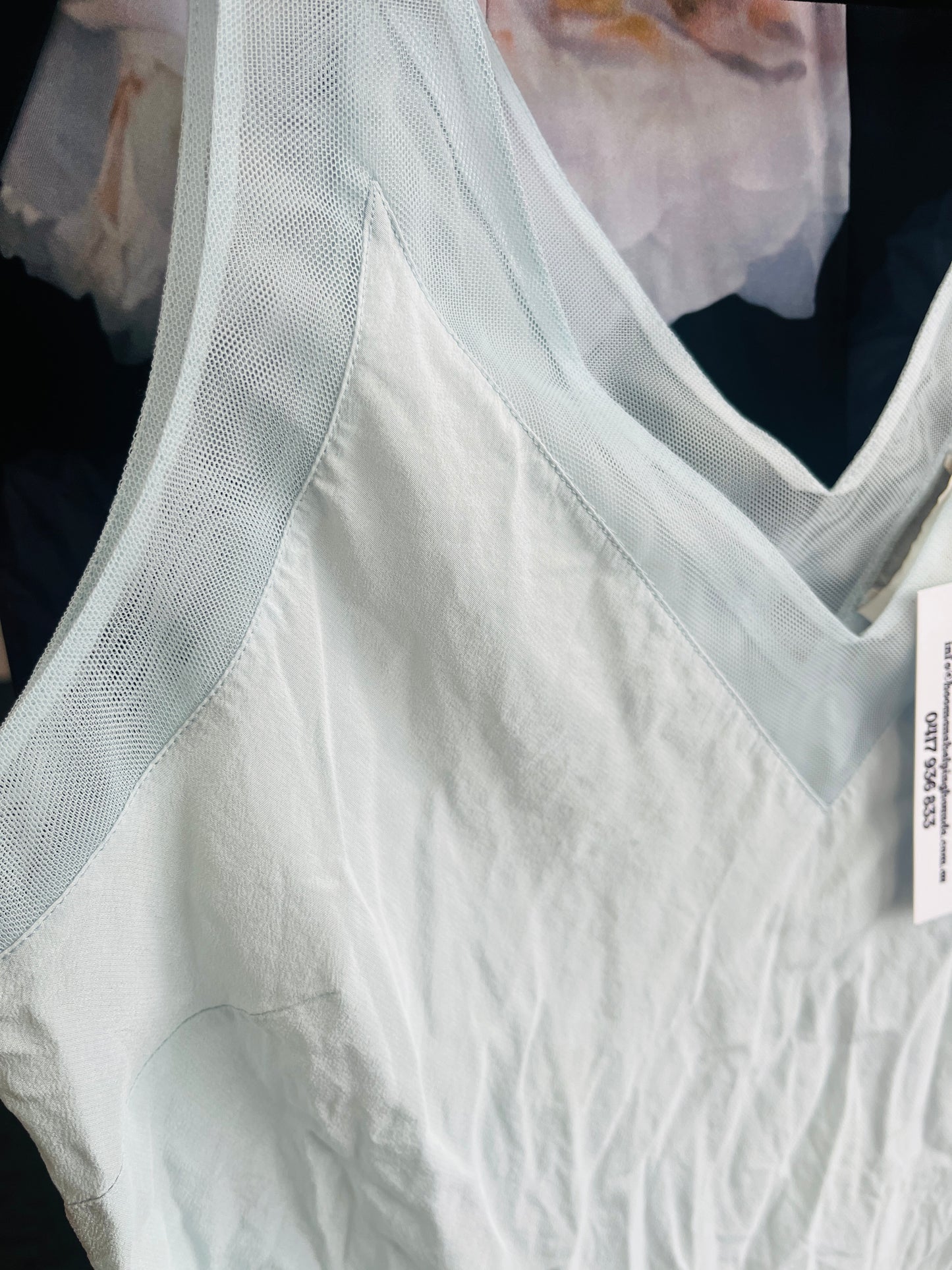 White textured fabric with a sheer overlay