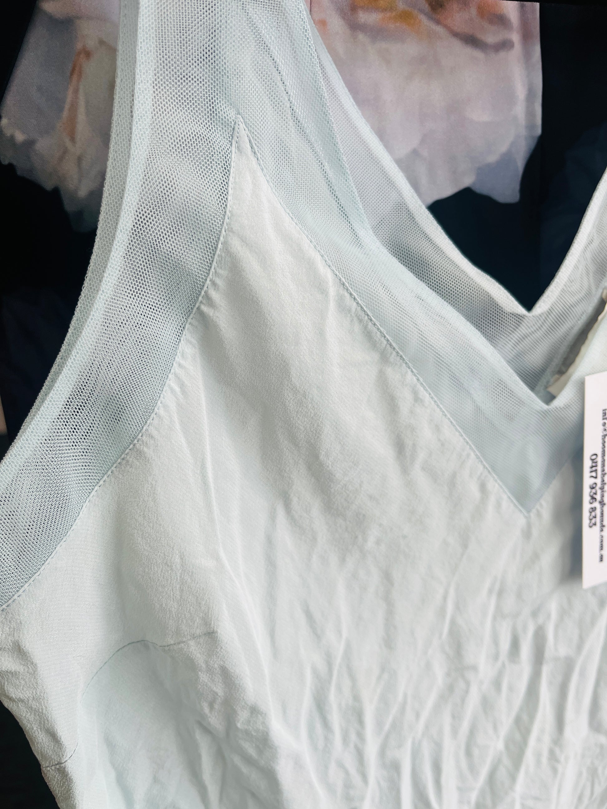 White textured fabric with a sheer overlay