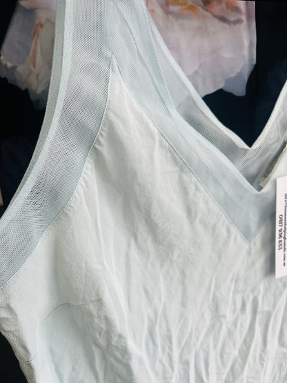 White textured fabric with a sheer overlay