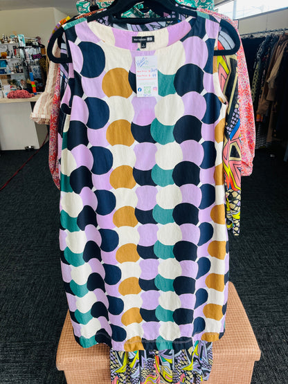 Colorful patterned dress on a hanger