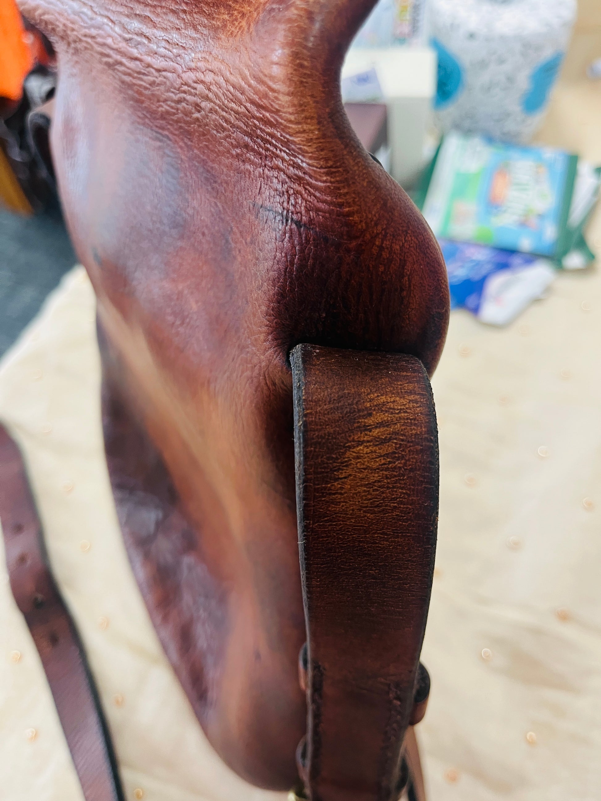 Close-up of a brown leather saddle
