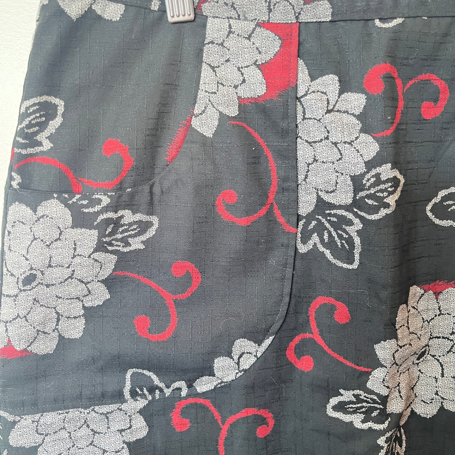 Floral patterned fabric with red and white flowers