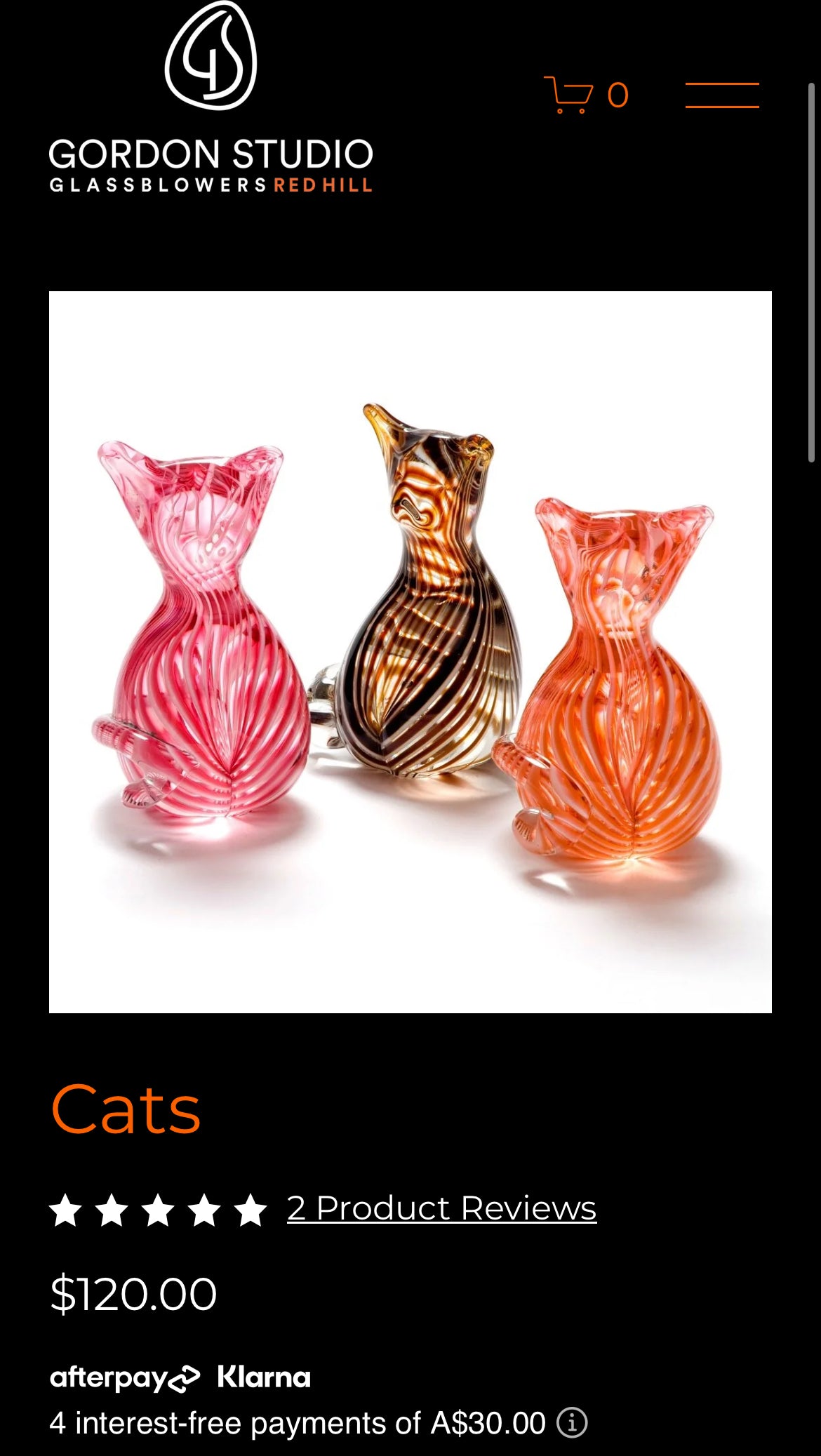 Three colorful glass cat-shaped