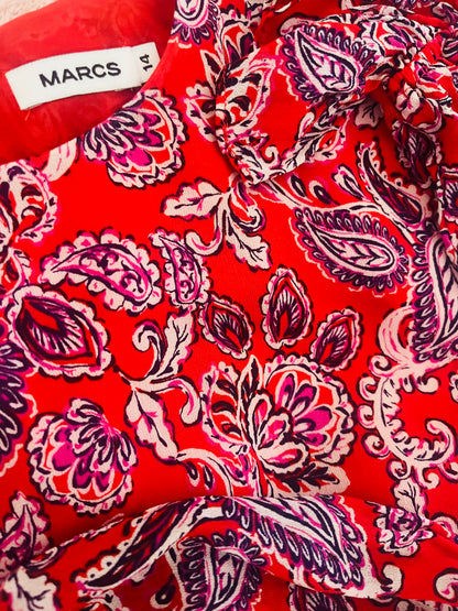 Red fabric with pink paisley pattern