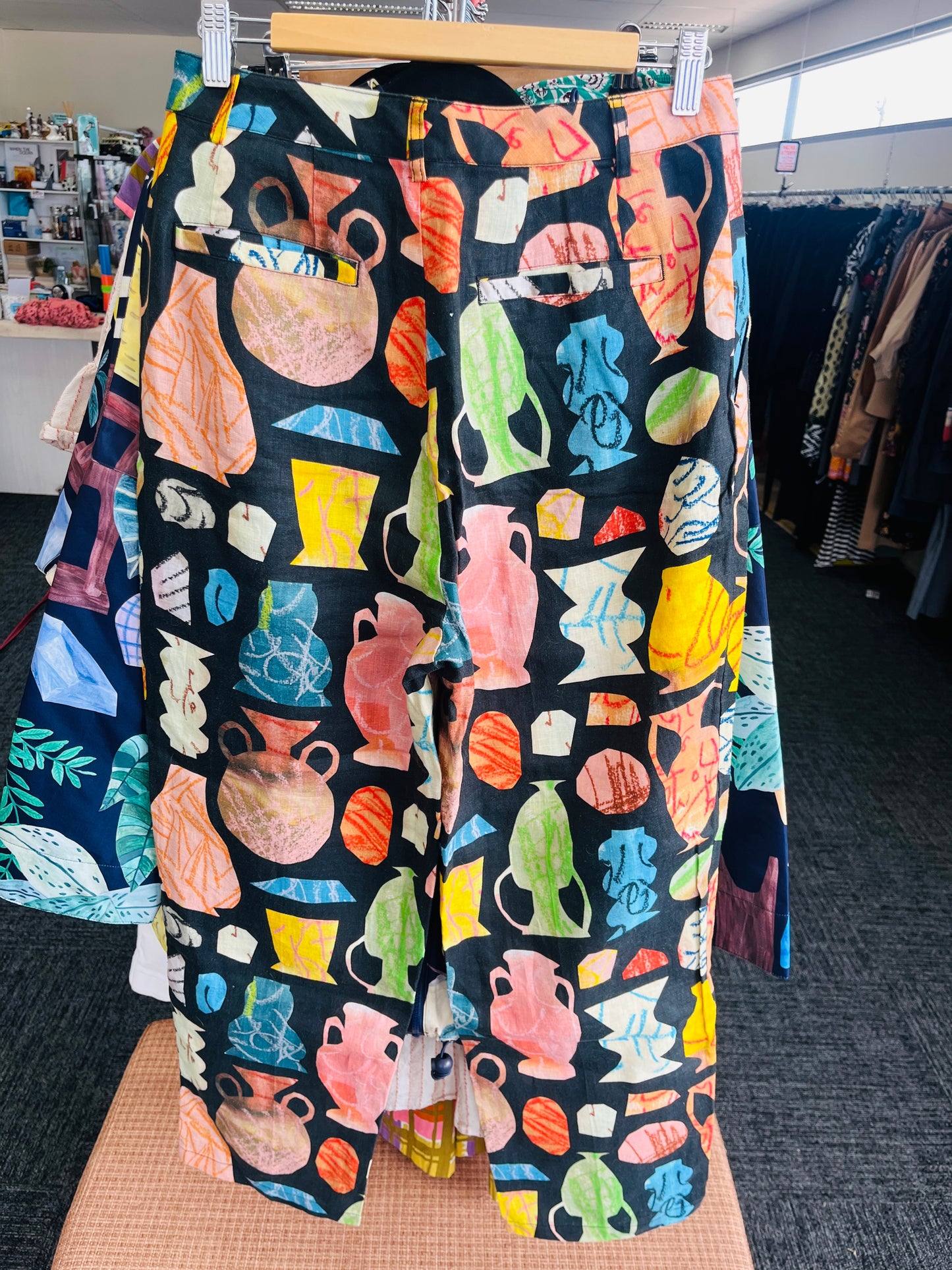 Colorful patterned pants on a hanger