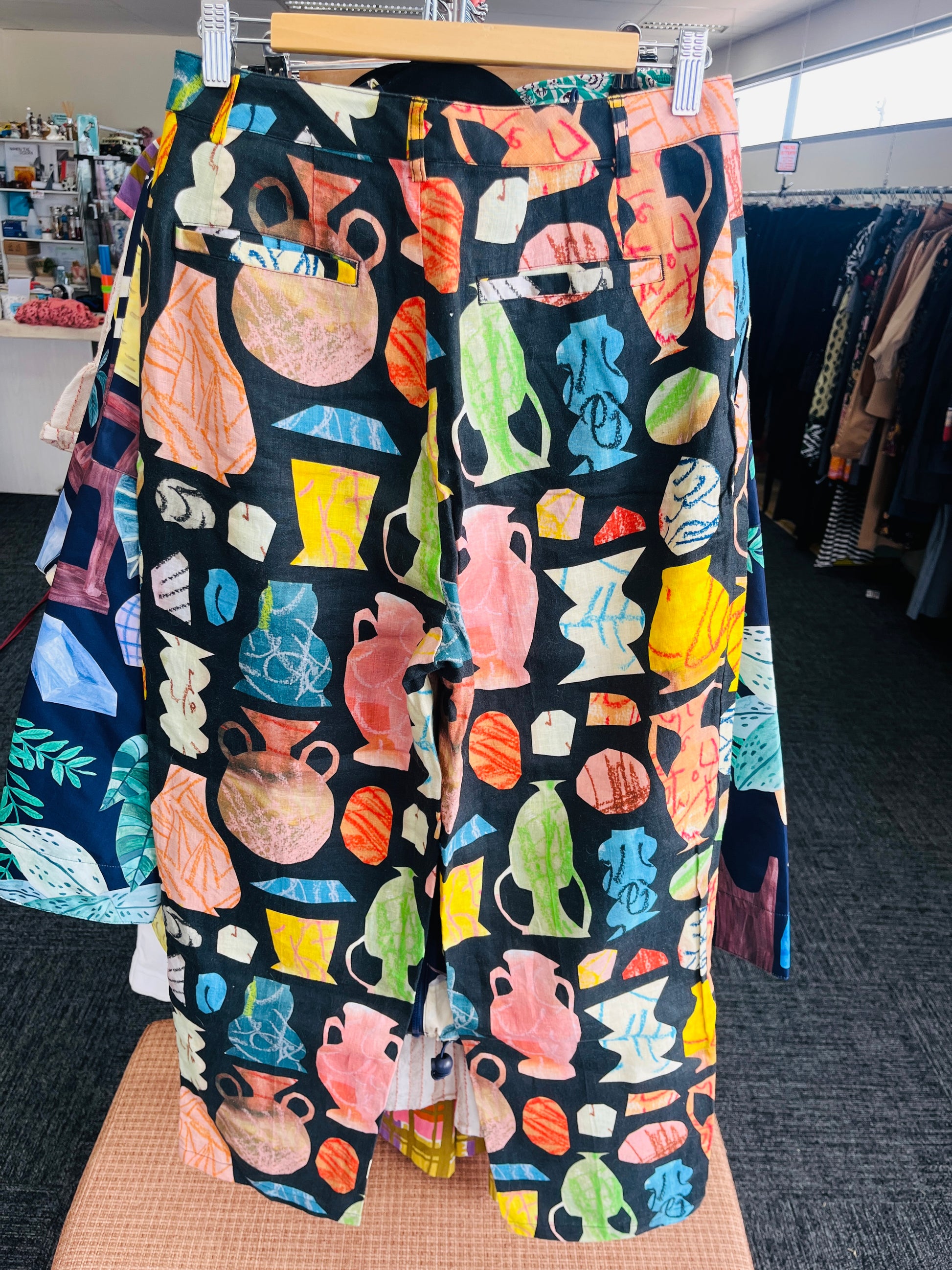 Colorful patterned pants on a hanger