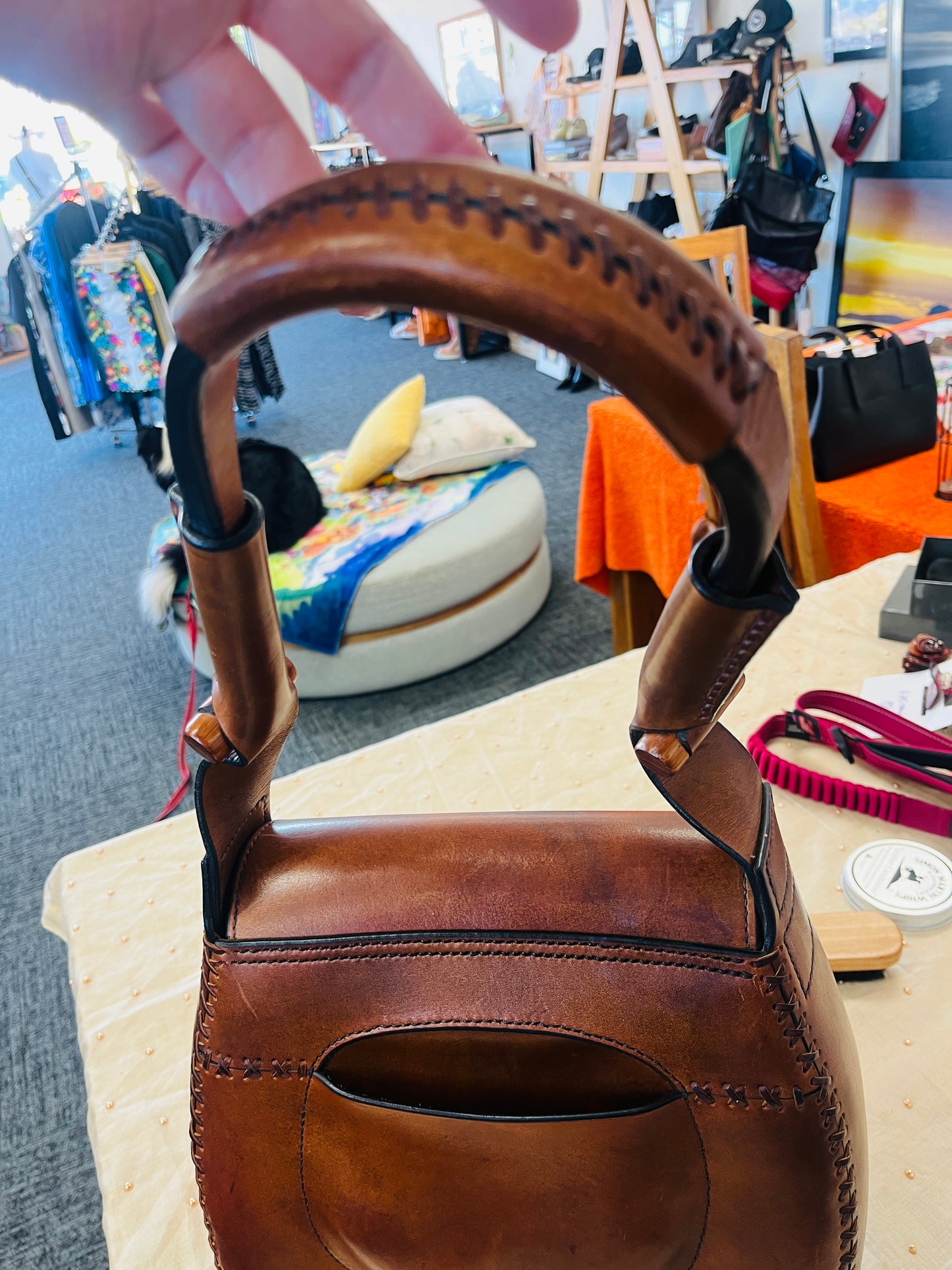 Brown leather bag with decorative handle