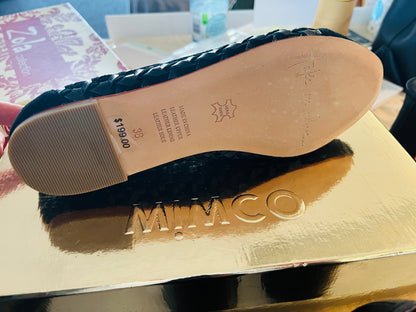 Black sandal on a gold MIMCO box