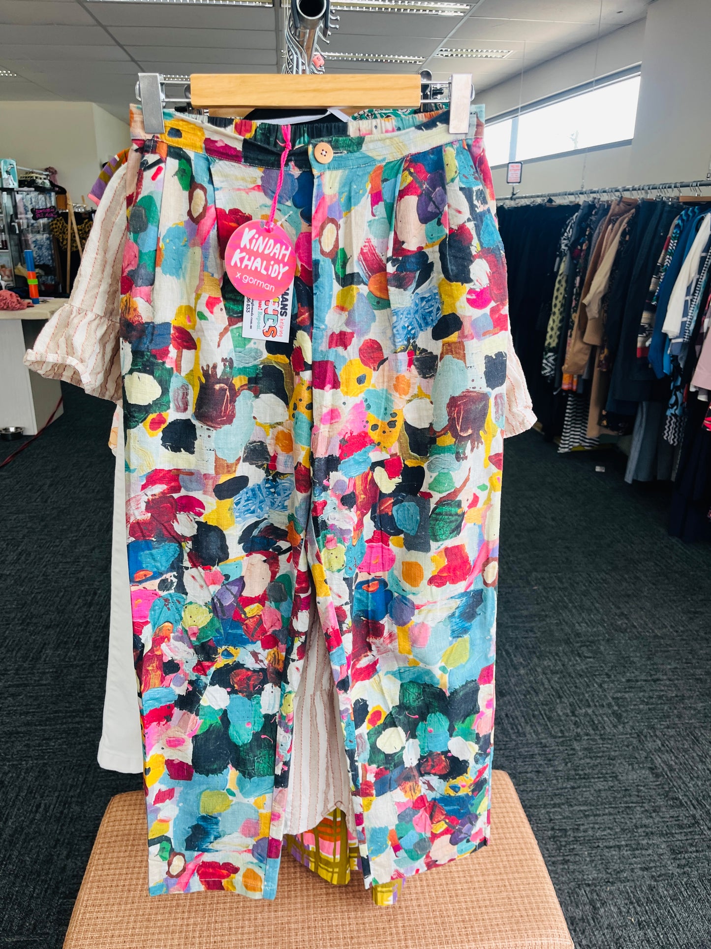 Colorful patterned pants on a hanger