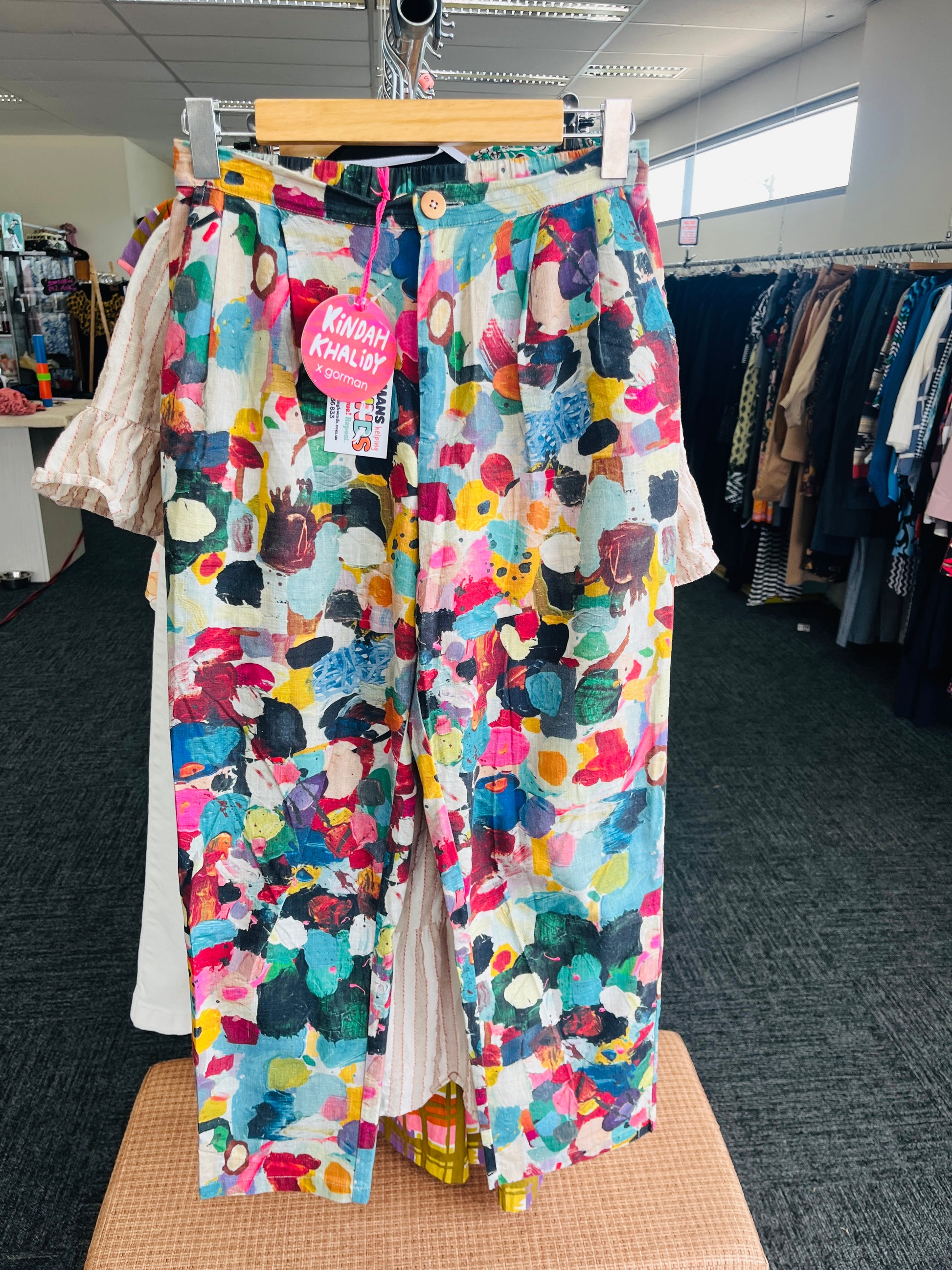 Colorful patterned pants on a hanger