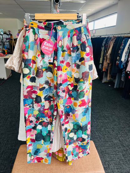 Colorful patterned pants on a hanger