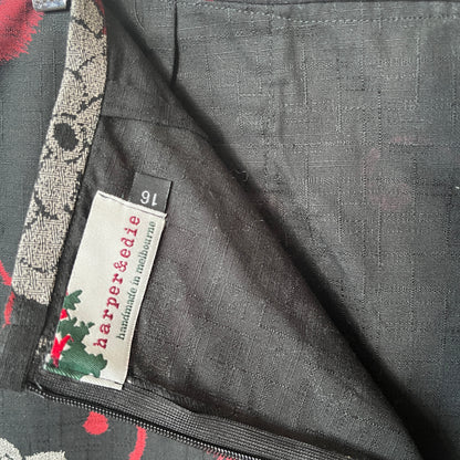 Close-up of a label on a garment with floral patterns and 'harper&edie' branding.