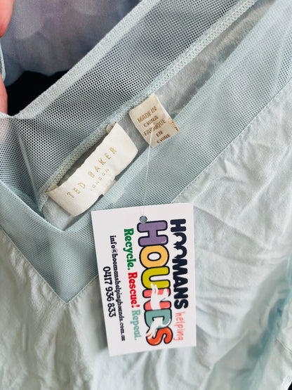 Close-up of a garment with a colorful tag