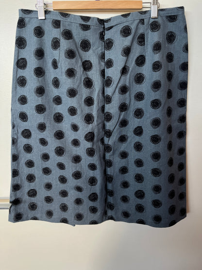 Black polka dot skirt on a hanger