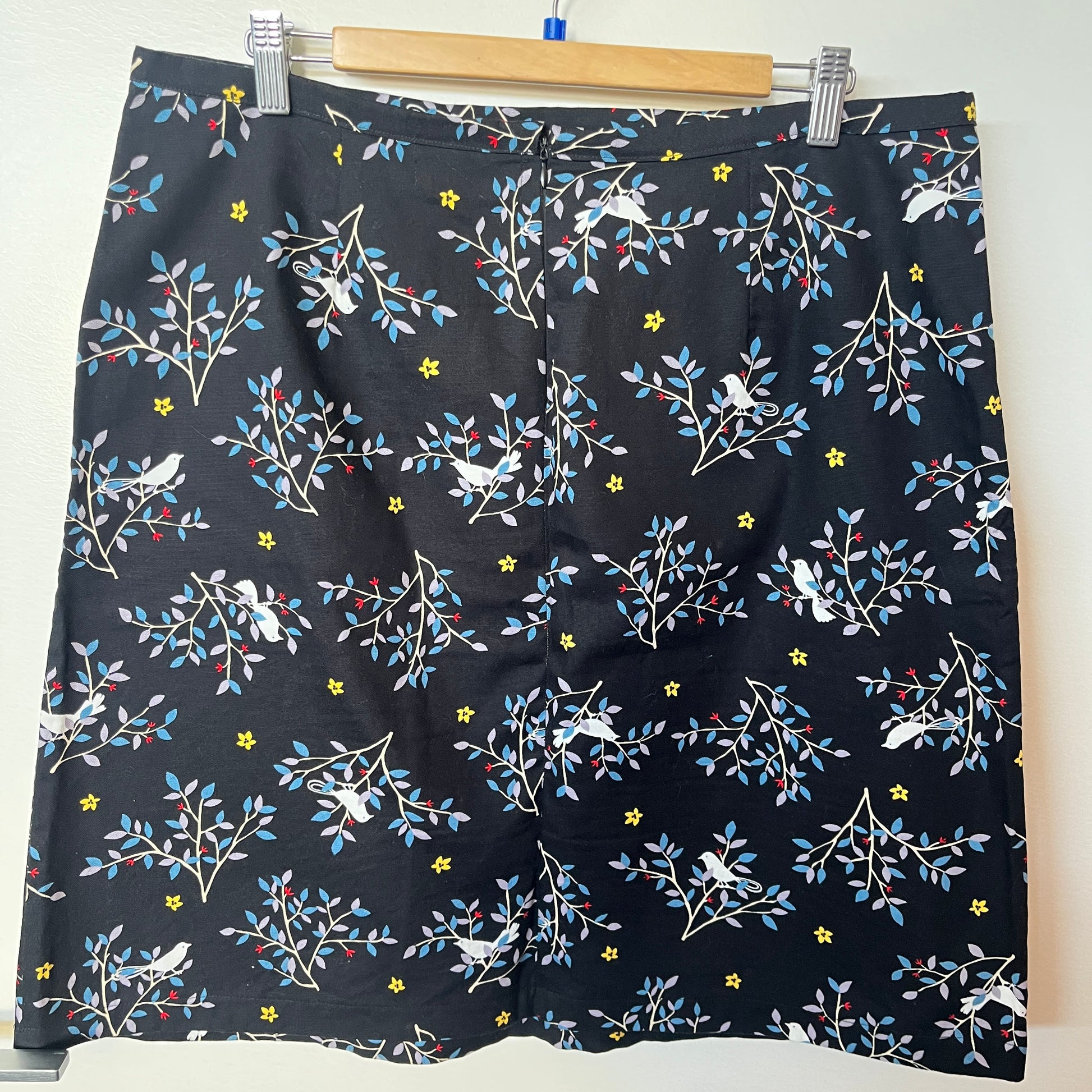 Floral patterned shorts on a hanger