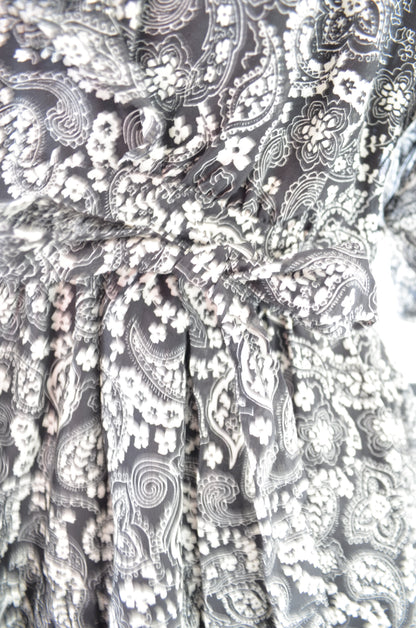 Close-up of a patterned fabric with black and white design