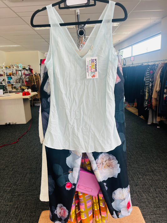 White tank top with a tag