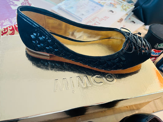 Black flat shoe on a MIMCO box