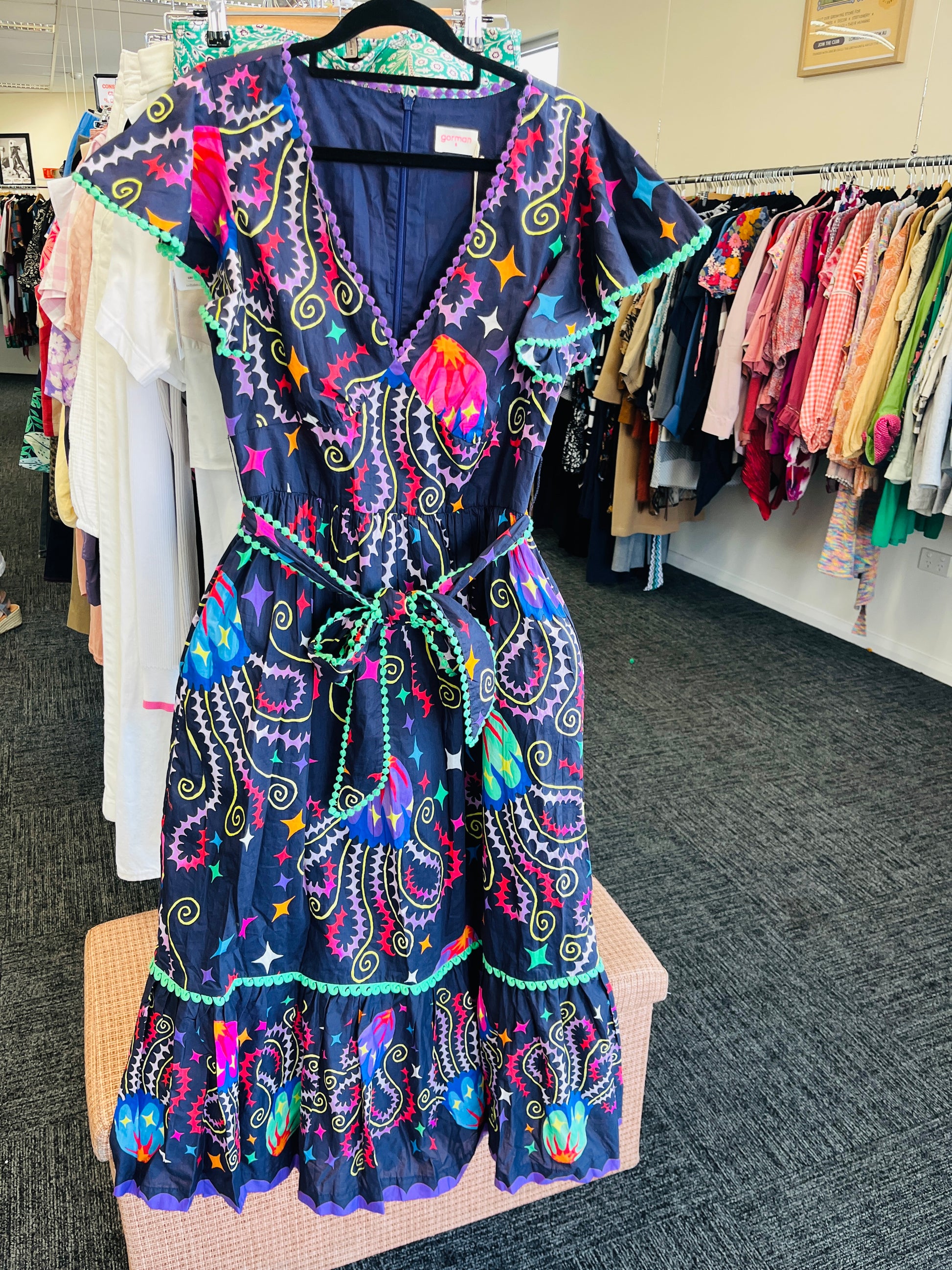 Colorful patterned dress on a hanger