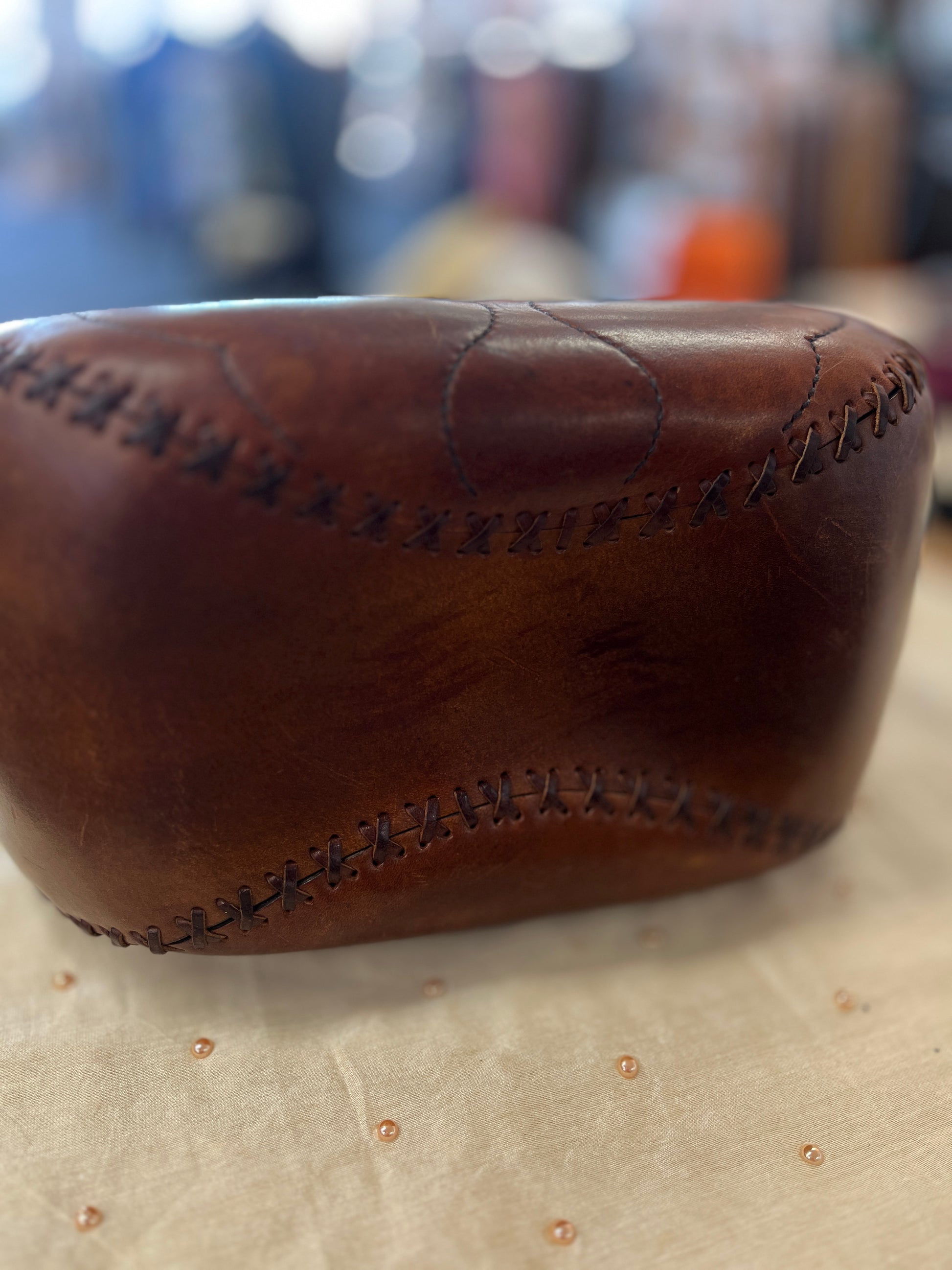 Brown leather product with visible stitching