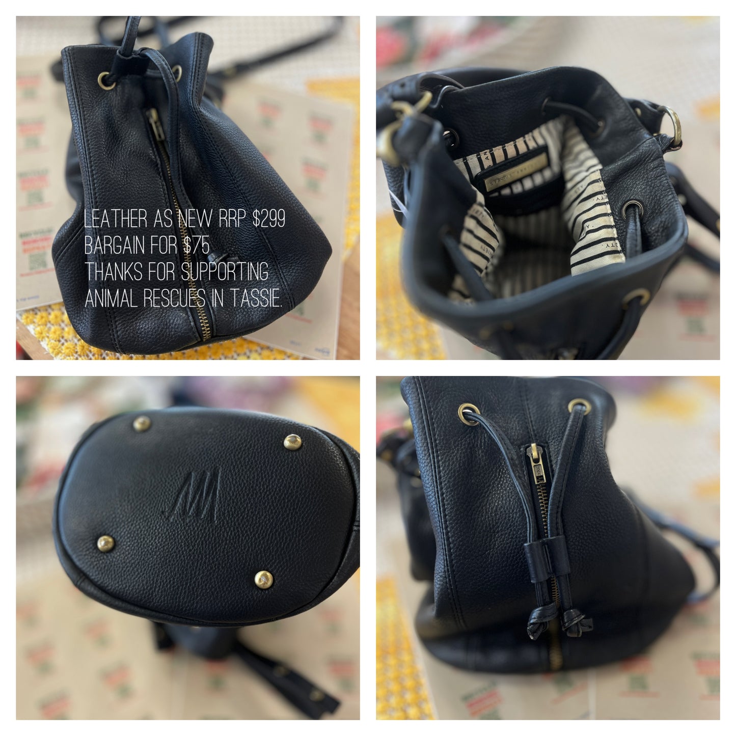 Black leather bag with gold studs and zippers
