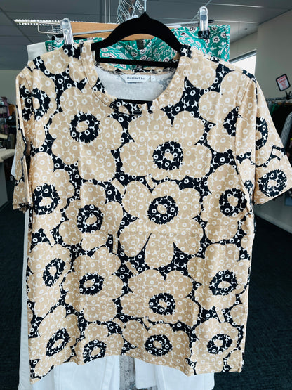 Floral patterned blouse on a hanger