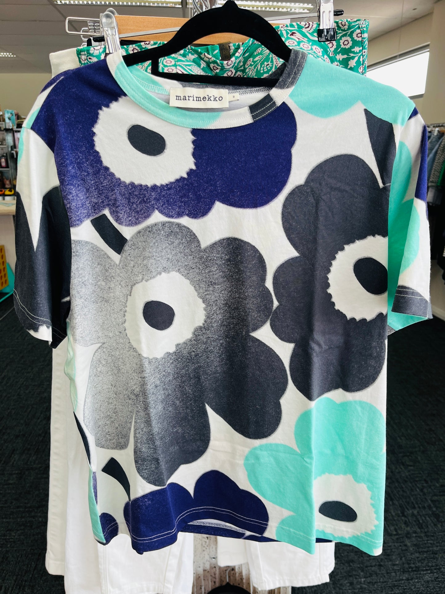 Floral patterned dress on a hanger