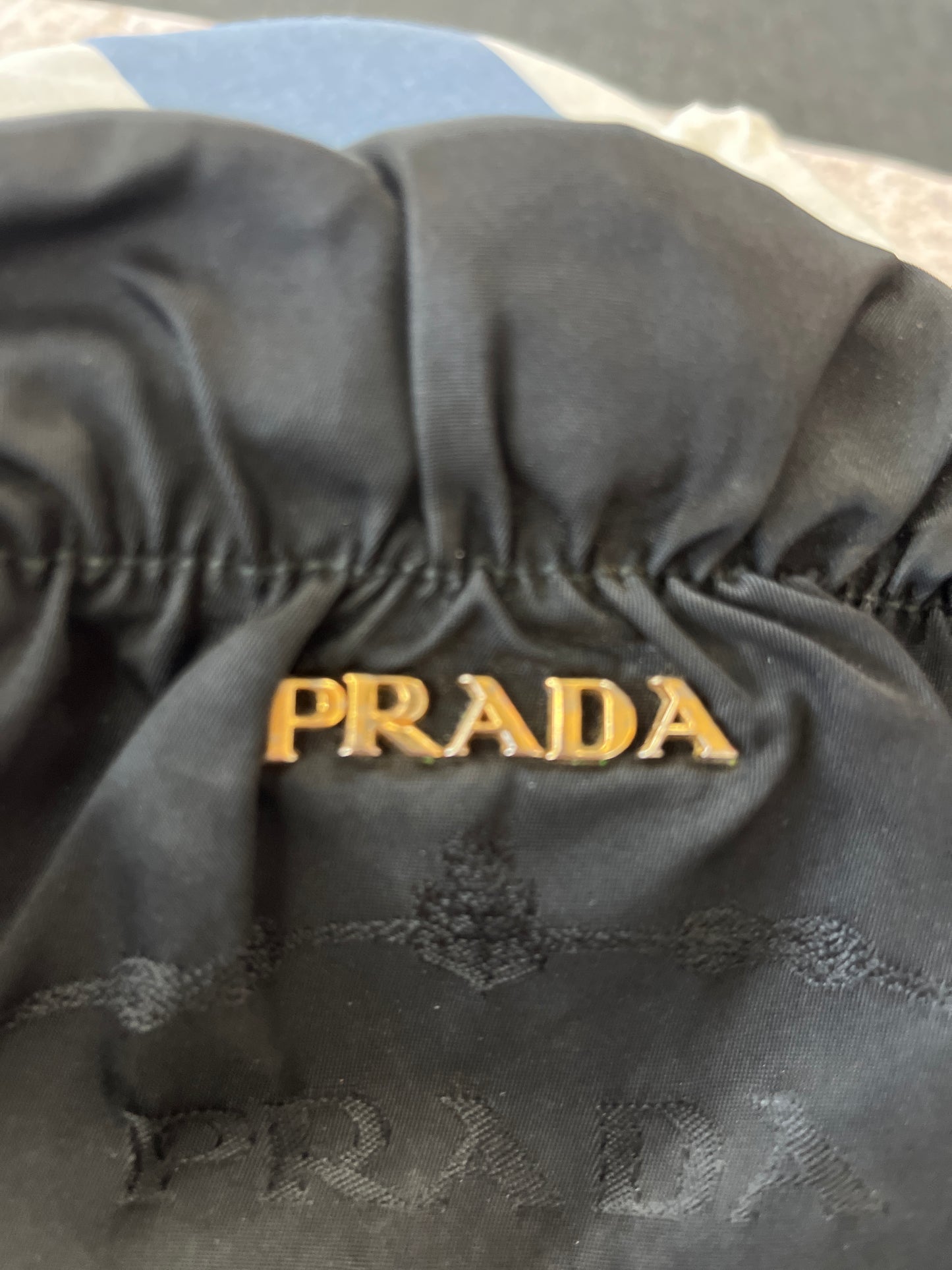 Black Prada bag with gold lettering