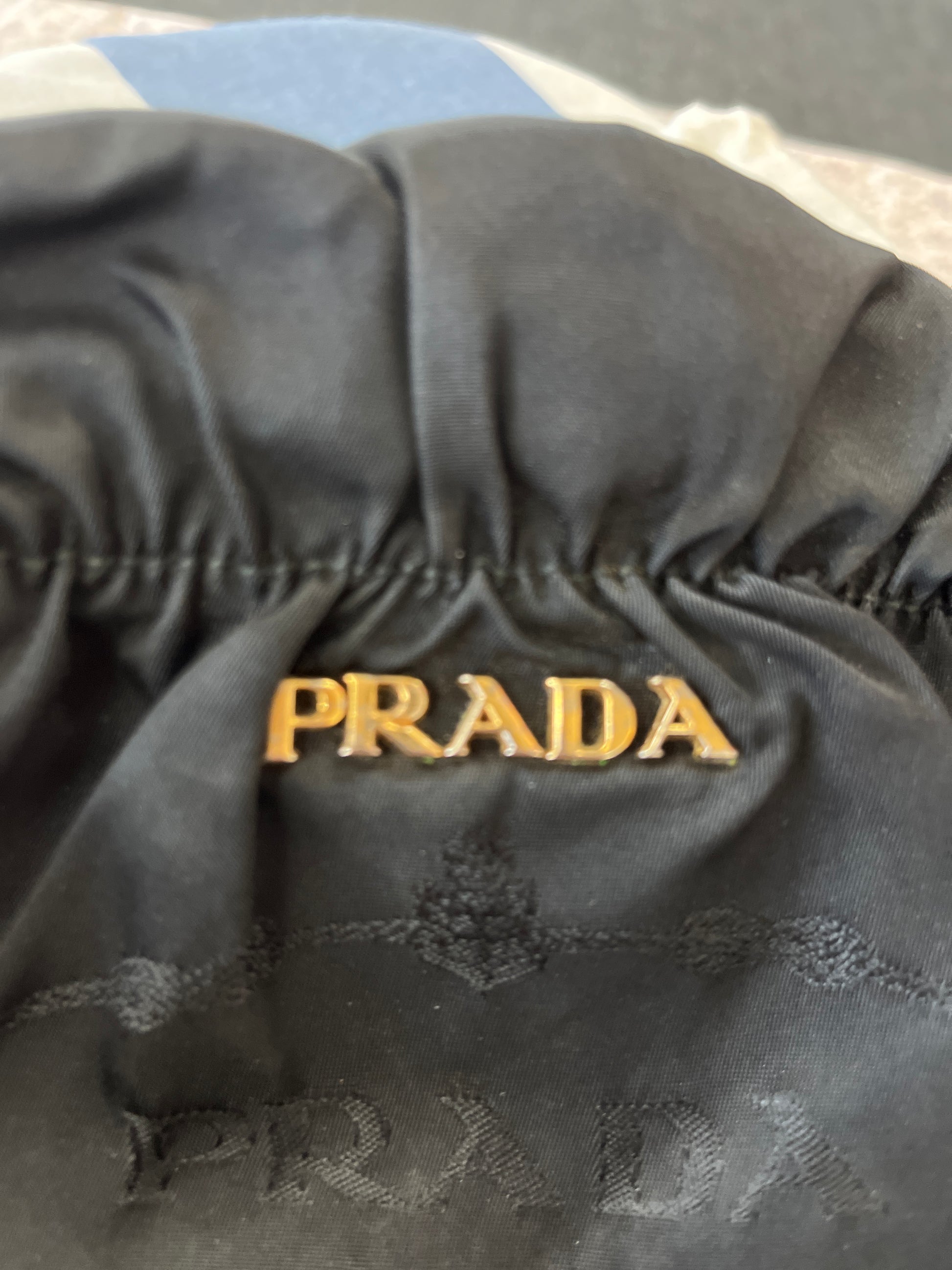 Black Prada bag with gold lettering